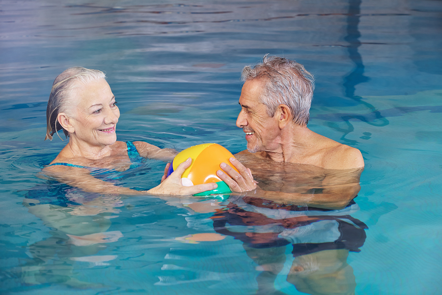 A senior couple enjoying the pool